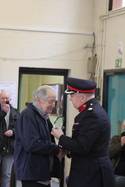 John Mackay being given his plaque
